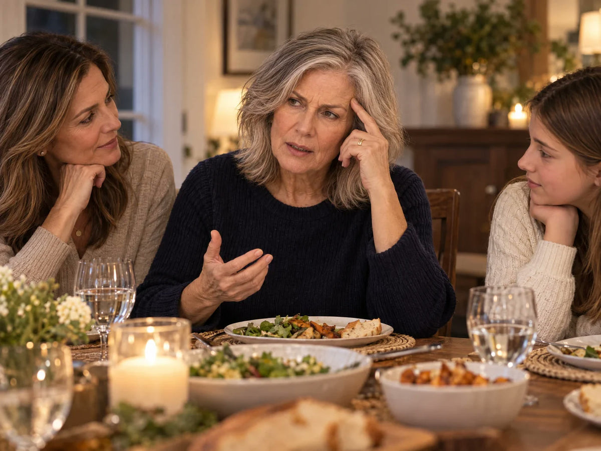 A mature woman pauses while searching for a familiar word during a family conversation